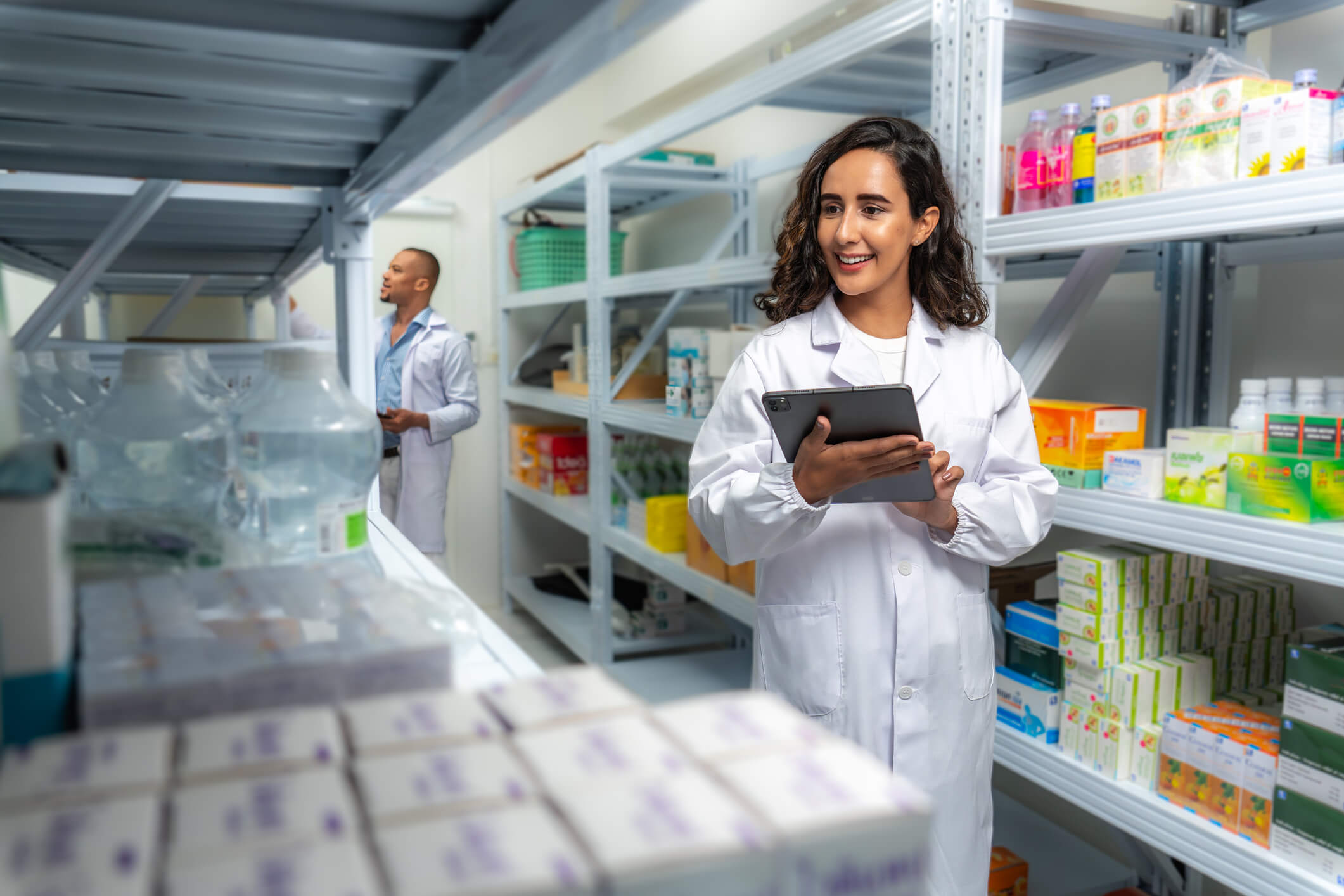 Pharmacists checking inventory in storeroom