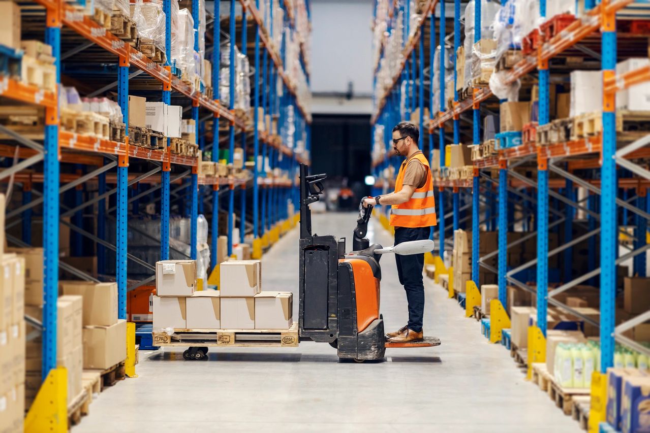 Warehouse worker operating a forklift